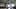 Video Generation Prompt: Mech in Aircraft Hangar