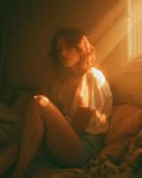 Photorealistic bedroom scene in warm late-afternoon sunlight