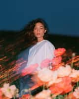 Create a cinematic fashion editorial portrait at blue hour