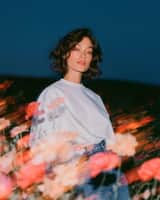 Create a cinematic fashion editorial portrait at blue hour