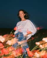 Create a cinematic fashion editorial portrait at blue hour