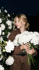 A candid nighttime editorial portrait of a young blonde