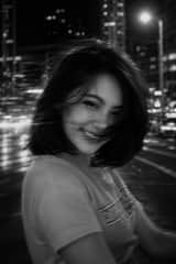 A black and white cinematic photograph of a young woman