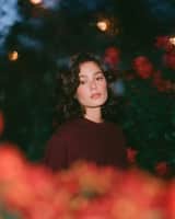 Dreamy cinematic nighttime portrait of a beautiful young