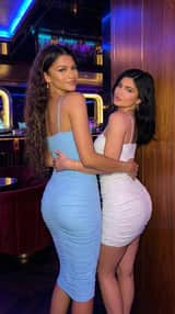 8K Fashion Photography of Two Women in Latex Dresses under Neon Light