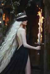 Dark fairytale woman with fire sword