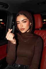 Luxury Car Hijab Portrait with Finger Heart