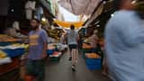 Runner Sprinting Through Crowded Market Video