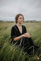 Serene Western Girl in Tall Grass Portrait