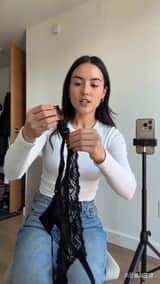 UGC video of a girl demonstrating stockings in a dressing room-2