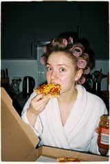 Ultra Photorealistic Candid Flash Portrait of a Woman Eating Pizza