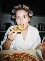 Ultra Photorealistic Candid Flash Portrait of a Woman Eating Pizza