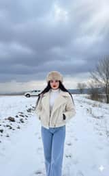 Winter Fashion Editorial in Snowy Field
