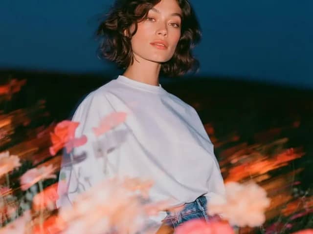 Create a cinematic fashion editorial portrait at blue hour