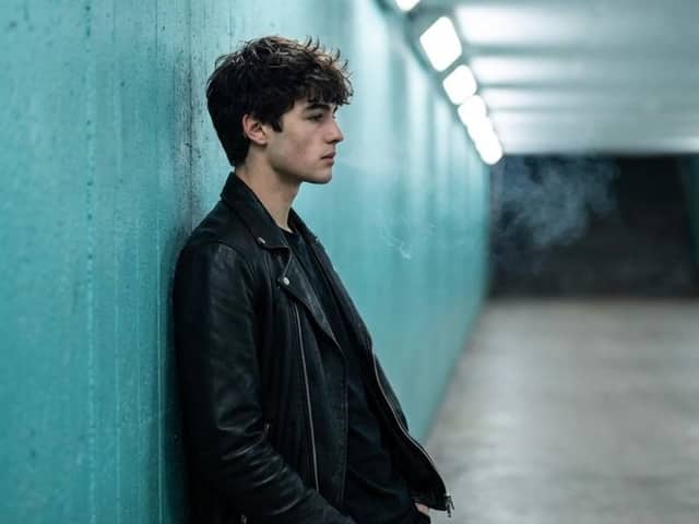 Cinematic Full Shot of a Man in a Turquoise Tunnel