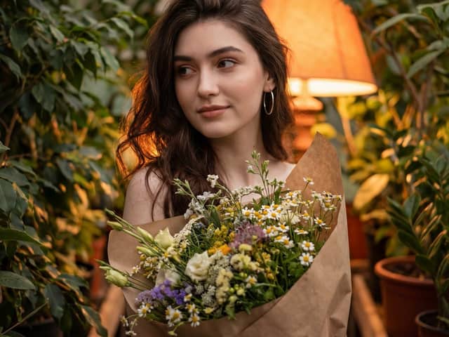 Atmospheric Portrait with Flowers and Warm Lighting
