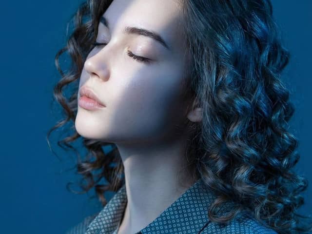 Editorial Profile Portrait in Dramatic Blue Light