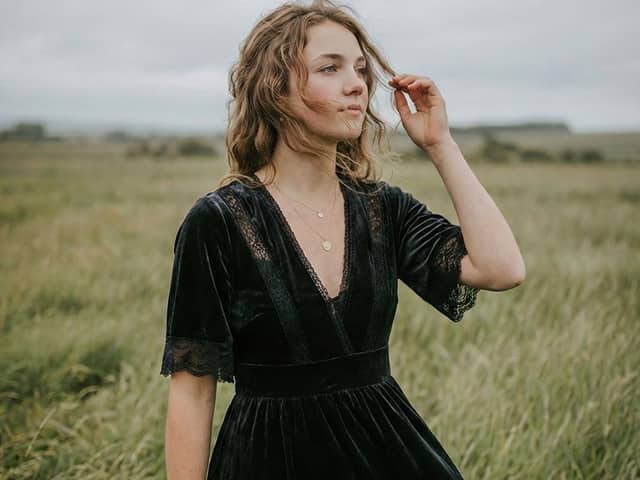 Serene Western Girl in Tall Grass Portrait