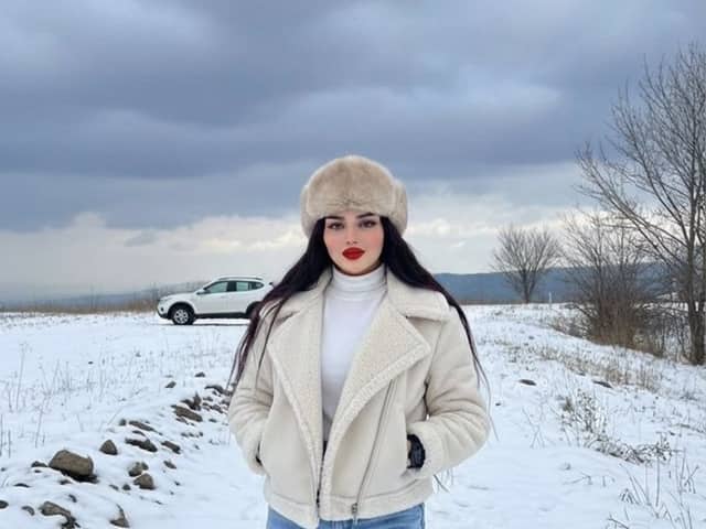 Winter Fashion Editorial in Snowy Field