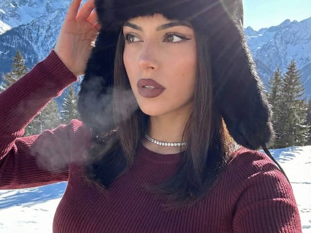 Winter Glam Selfie in Fur Hat on Snowy Mountain
