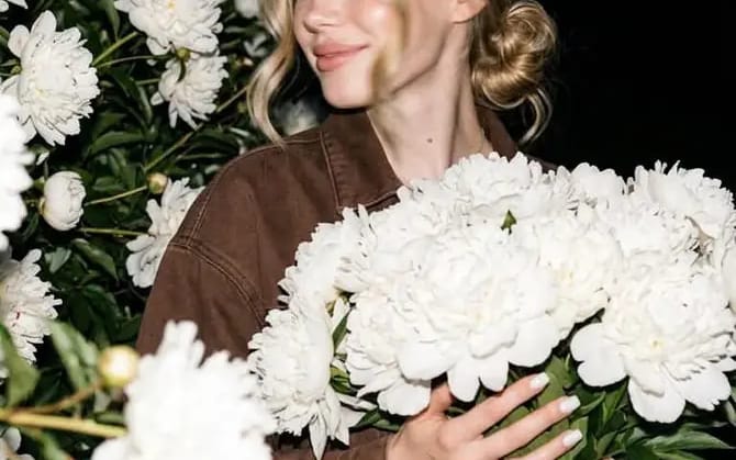 A candid nighttime editorial portrait of a young blonde