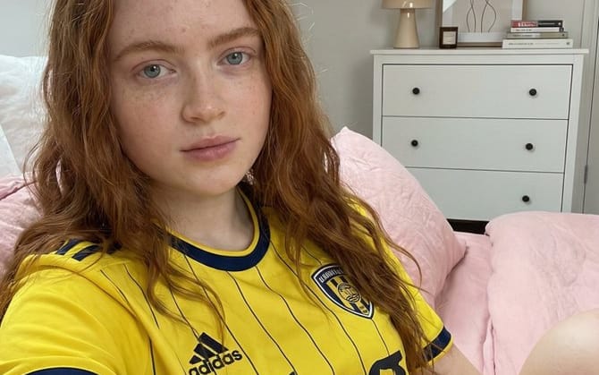 Photorealistic Selfie of Sadie Sink in a Soccer Jersey