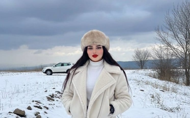 Winter Fashion Editorial in Snowy Field