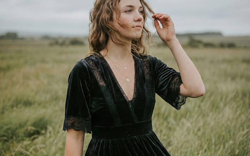 Serene Western Girl in Tall Grass Portrait