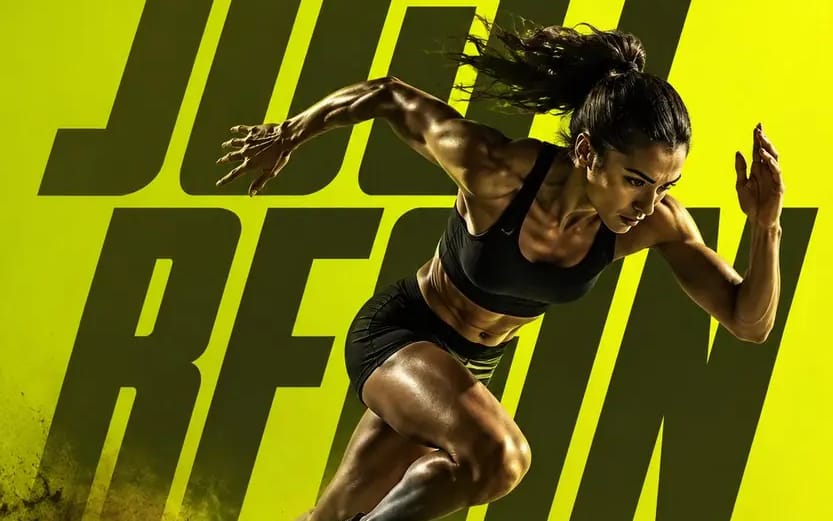 Full-body action shot of a female athlete explosively