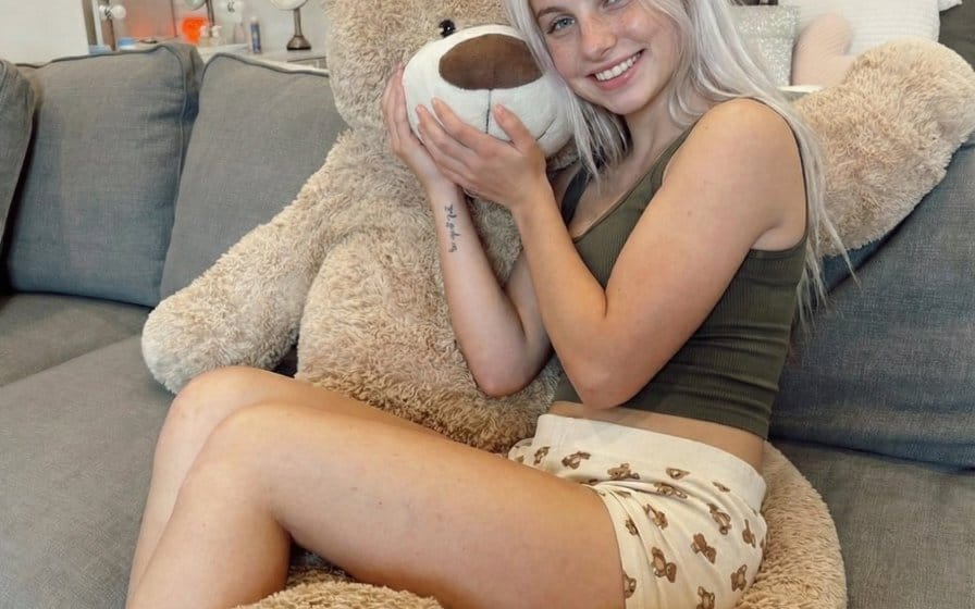 Candid Snapshot of Woman Hugging a Giant Teddy Bear
