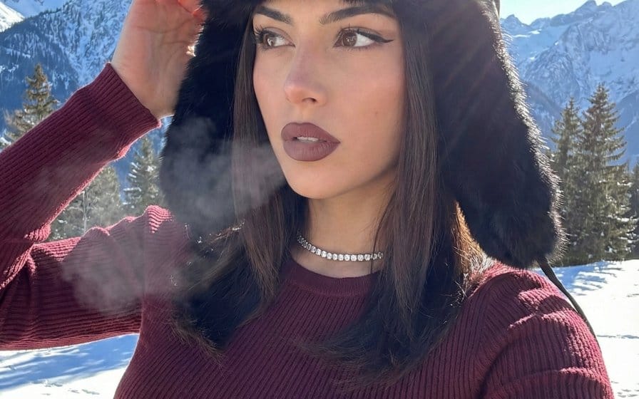 Winter Glam Selfie in Fur Hat on Snowy Mountain