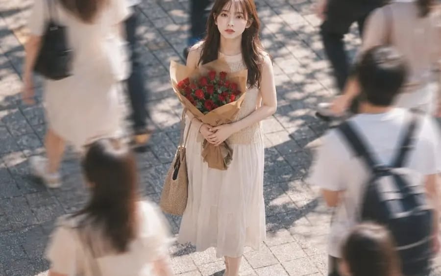 A Red Rose Stopped in the Crowd