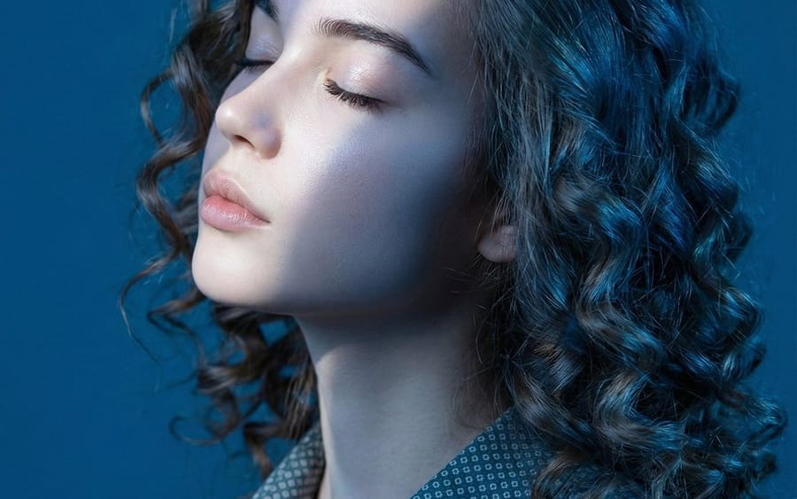 Editorial Profile Portrait in Dramatic Blue Light