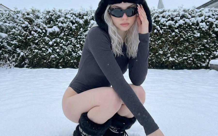 Winter Editorial Low-Angle Squat Pose Prompt (iPhone Style)